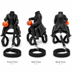 Three views of a black gothic-style miniature figurine depicting a woman in a long coat riding a small cart with a pumpkin, shown on a white background with front, side, and back labels.